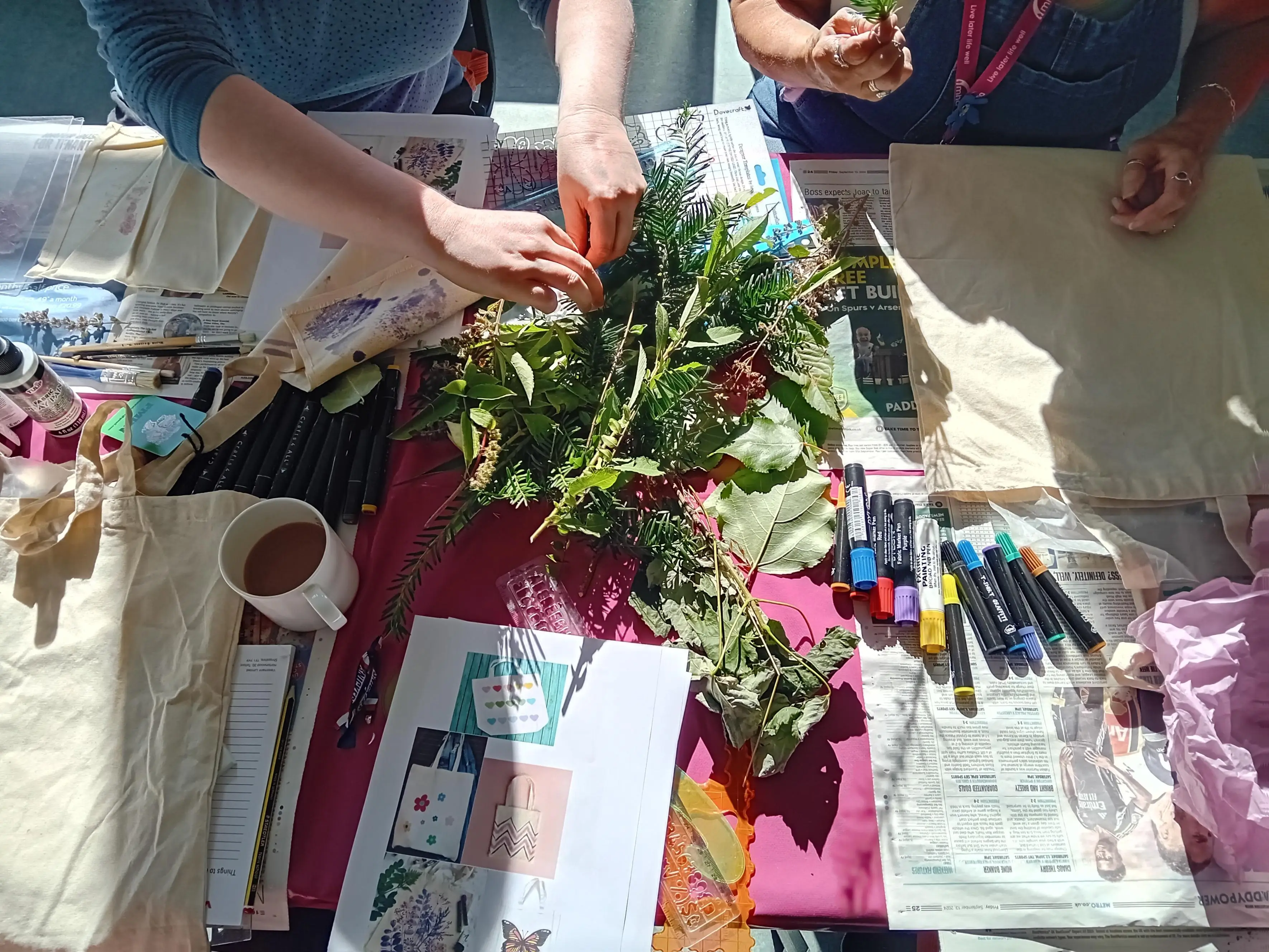 a pile of leaves on the table for crafters to choose from