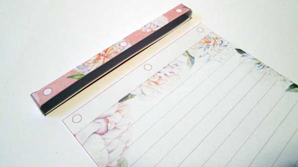 Holes to punch on holder and pages if you want a refillable book