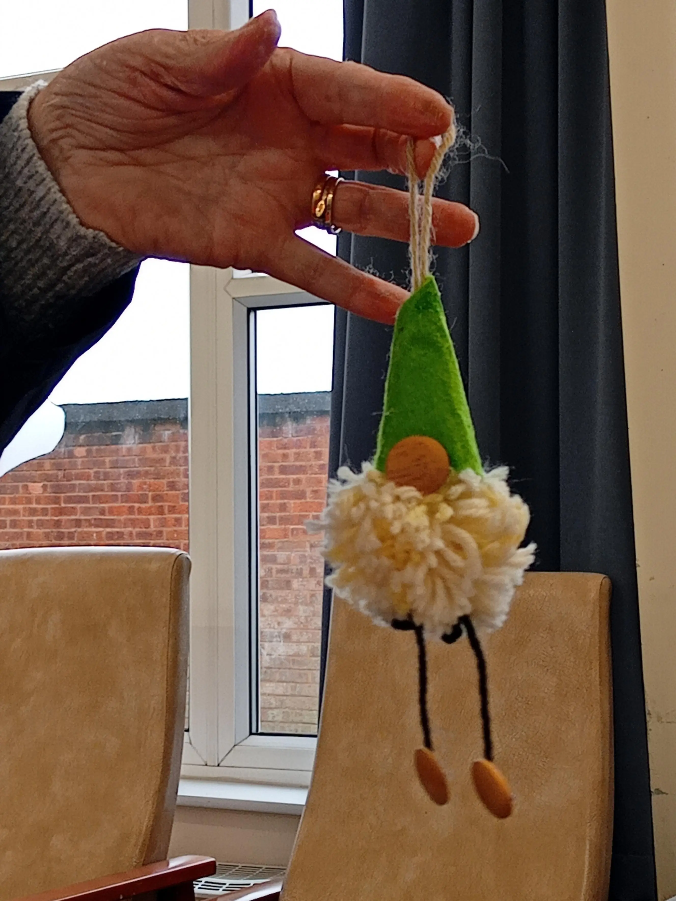 a crafter shows off their finished gonk