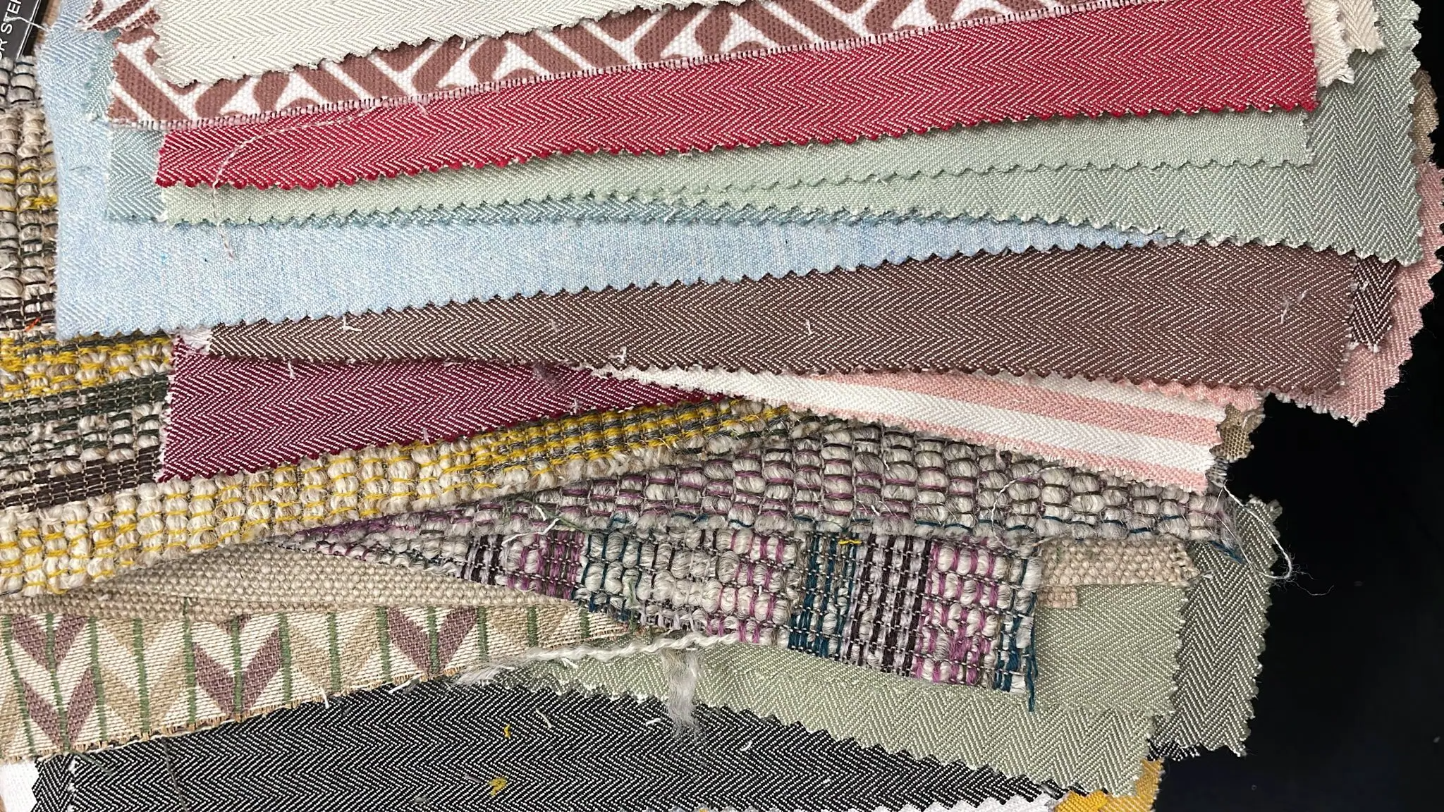 fabric swatches laid out on a table fabric swatches laid out on a table